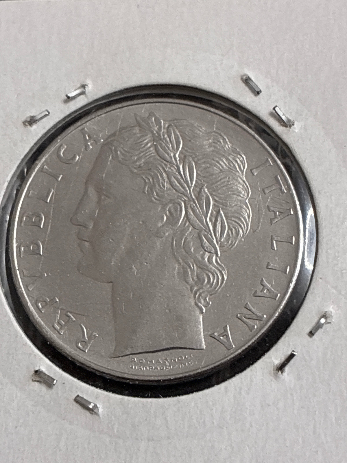 100 lire 1977 Errore di Conio per Mancanza di Metallo sulla Guancia al Dritto