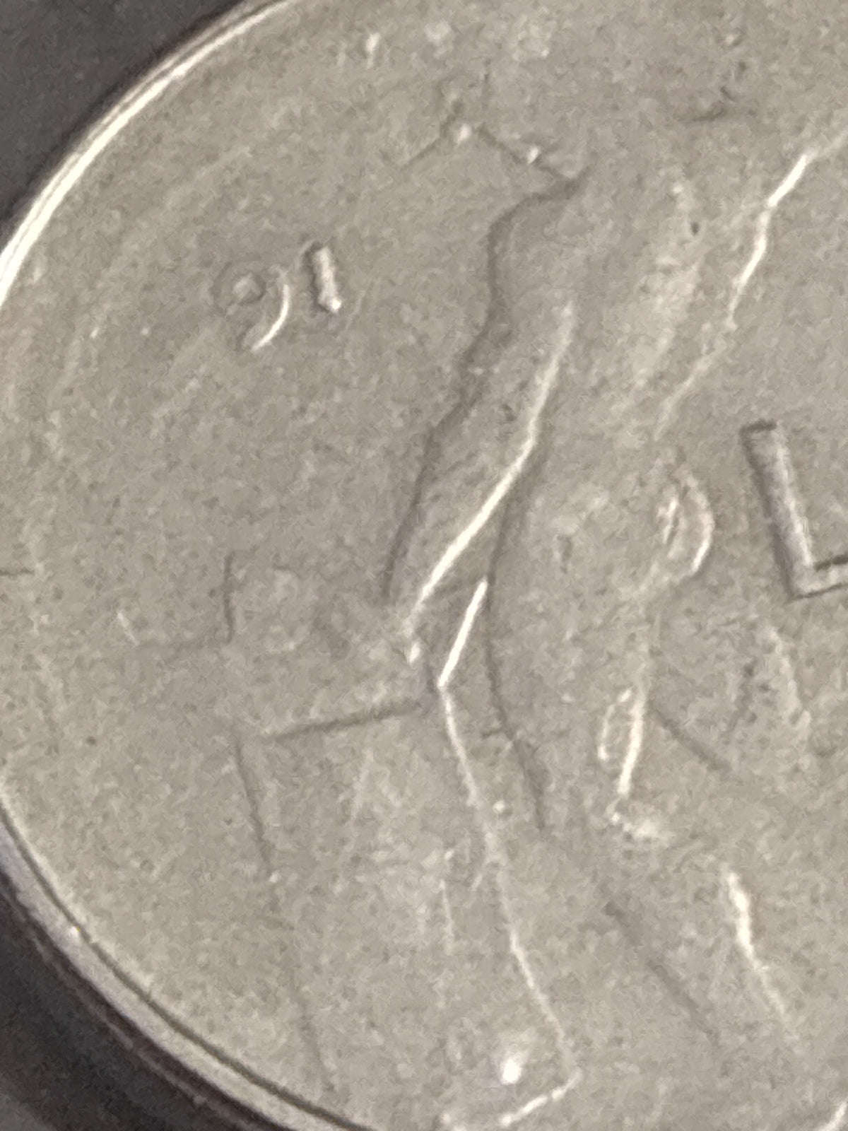 50 lire del 1991 Vulcano micro errore conio stanco manca data e dettagli testa e valore