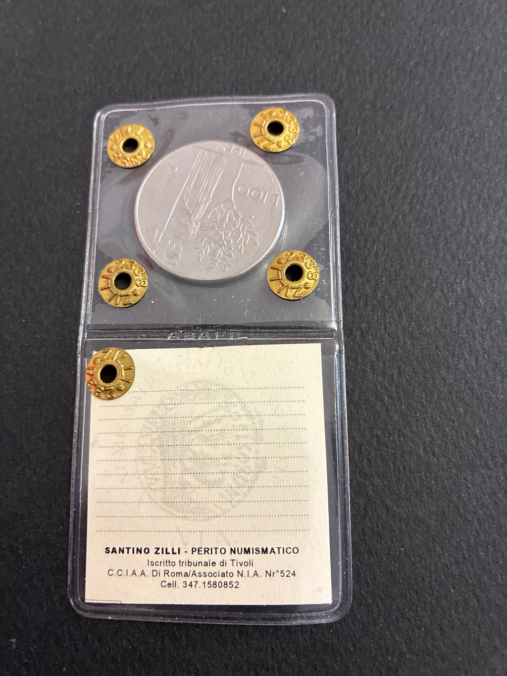 Moneta periziata da 100 Lire 1987 Minerva - Variante di conio "Il nr 7 a uncino" (Gigante 124a) - Grado BB / NC