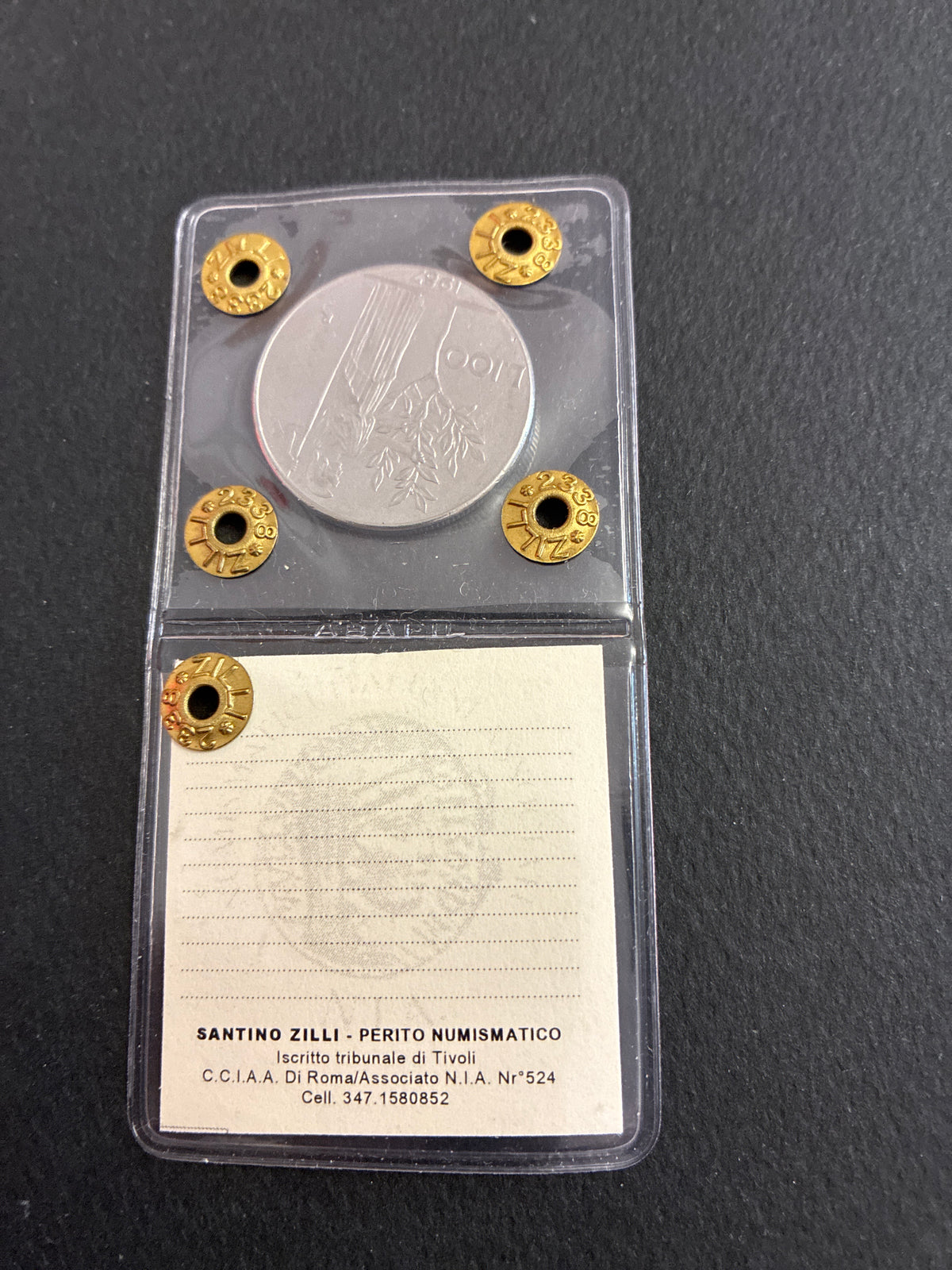 Moneta periziata da 100 Lire 1987 Minerva - Variante di conio "Il nr 7 a uncino" (Gigante 124a) - Grado BB / NC
