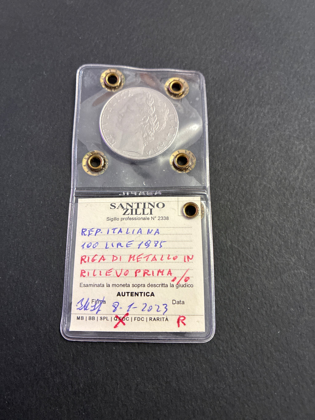 100 Lire 1985 Minerva Rara con Riga di Metallo in Rilievo prima della Data Periziata Q.FDC