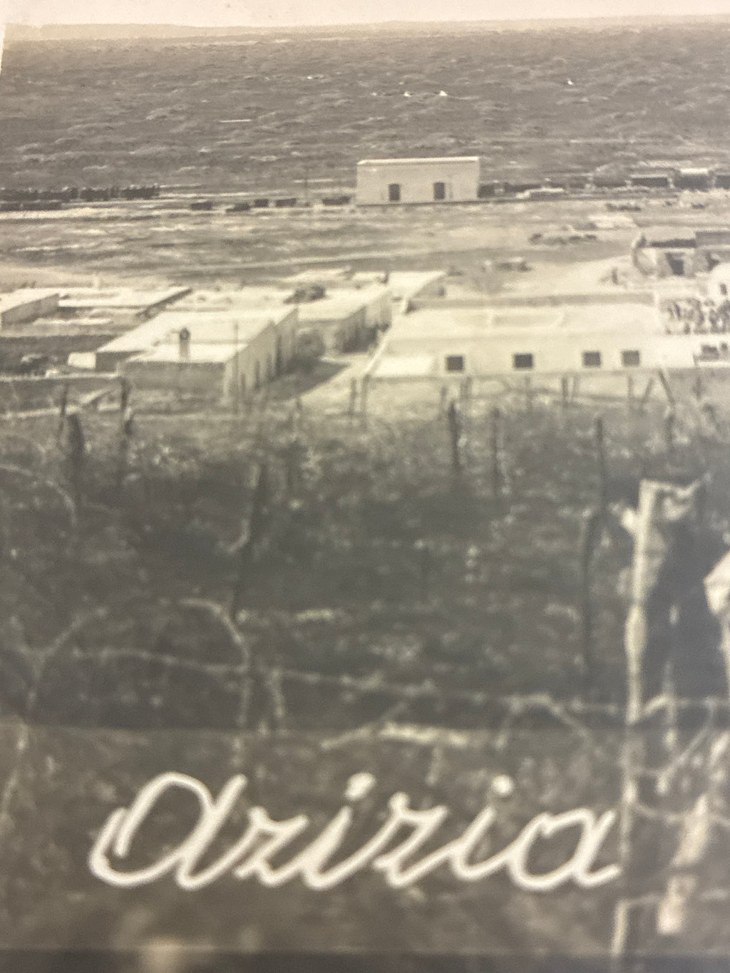 Cartolina postale italiana d'epoca coloniale del 1919 con veduta panoramica del fortino militare e del villaggio di Azizia in Libia.