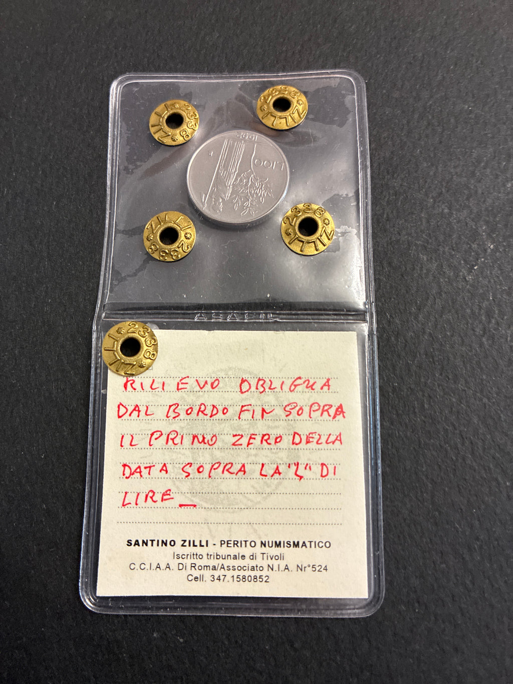 Moneta da 100 Lire 1992 Periziata Zilli - Errore di Conio: I Nr 99 Chiusi e Riga di Metallo in Rilievo Obliqua