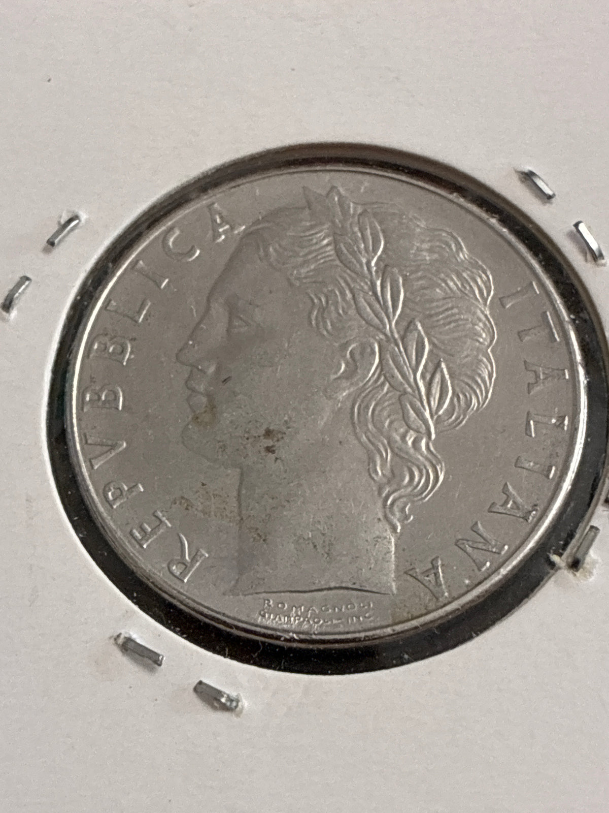 100 Lire 1977 Repubblica Italiana Minerva variante con errore di conio per esubero o mancanza di metallo tra i numeri della data