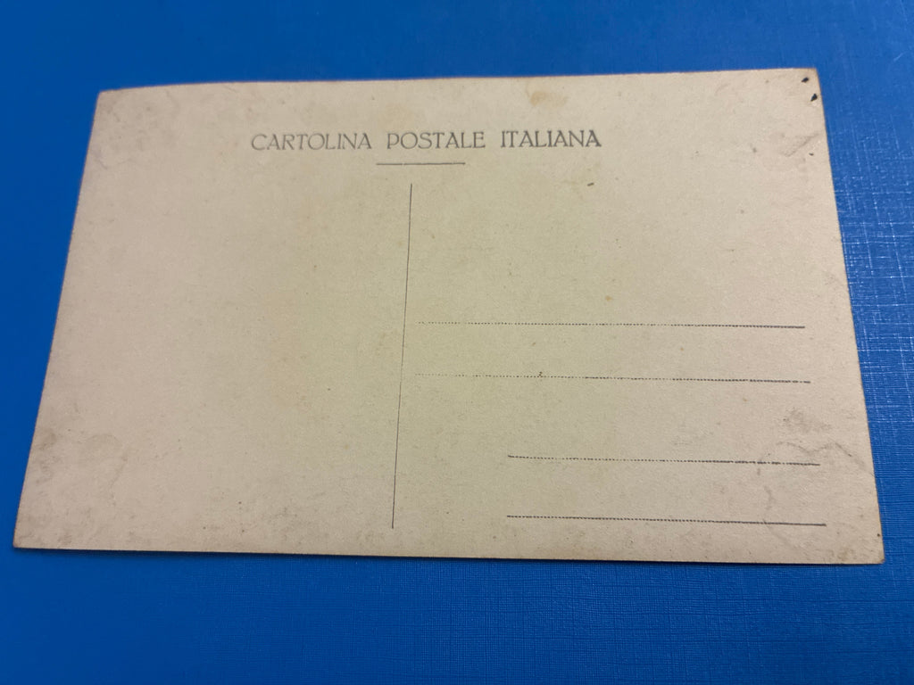 Cartolina postale italiana d'epoca coloniale del 1919 con veduta di Beni Ulid in Libia e indigeno locale in abiti tradizionali arabi.